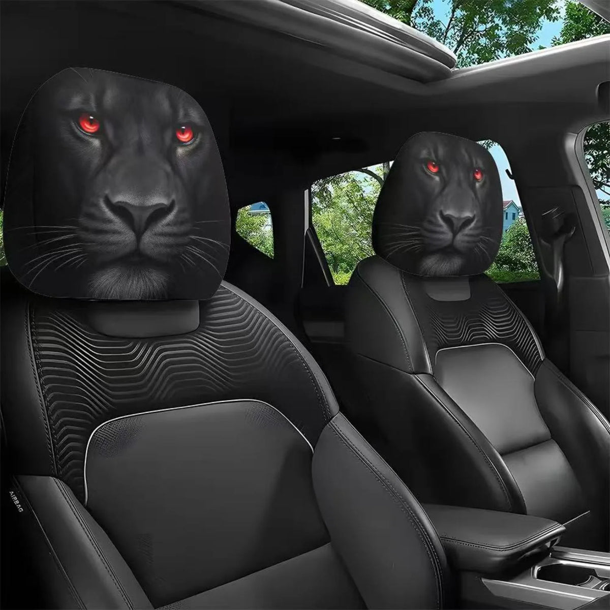 Dos protectores de cabezal de animal negros con ojos rojos brillantes instalados en el interior de un asiento de coche.