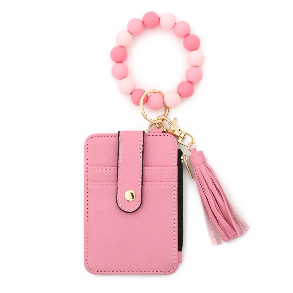 Pink beaded tassel keychain wristlet with card holder featuring a pink leather case and pink beads