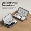 Organizador portátil de compartimento de cristal gris que protege accesorios de arañazos.