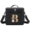 Black insulated canvas lunch bag with a large gold letter B and dual handles