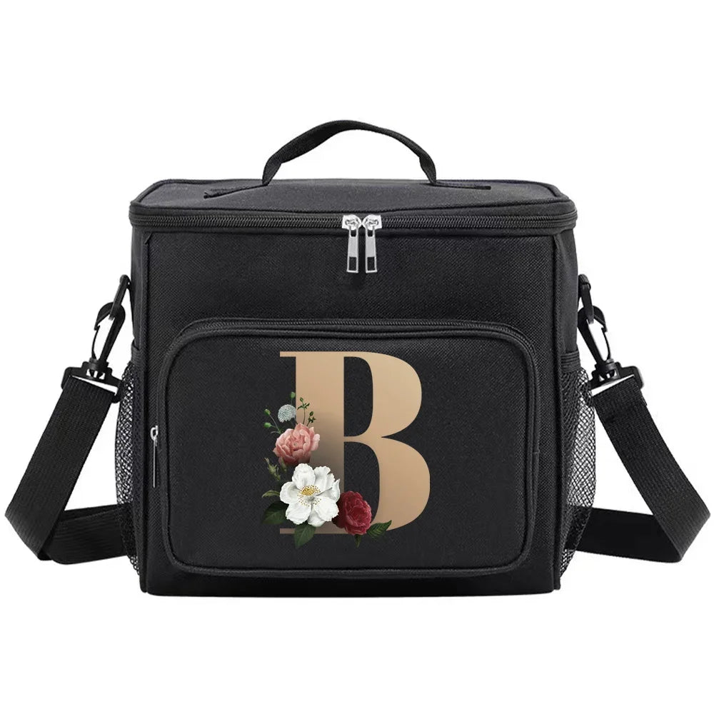 Black insulated canvas lunch bag with a large gold letter B and dual handles