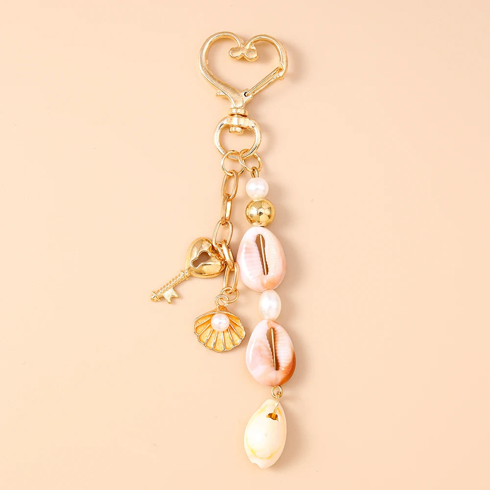 Gold and pink seashell starfish keychain with pearl accents