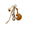 A leather croissant-shaped keychain with a lanyard and pendant.