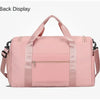 A pink large capacity travel duffle bag with a handle and zippered compartments.