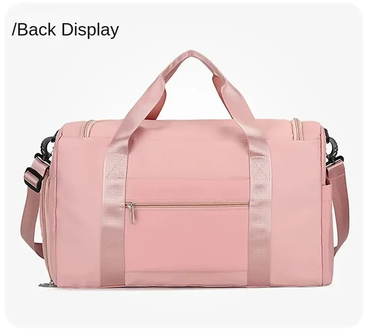A pink large capacity travel duffle bag with a handle and zippered compartments.