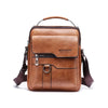 A brown vintage PU leather crossbody messenger bag with a leather handle and strap.