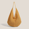 A mustard yellow crochet shoulder bag with a mesh detailing, shown from the front.