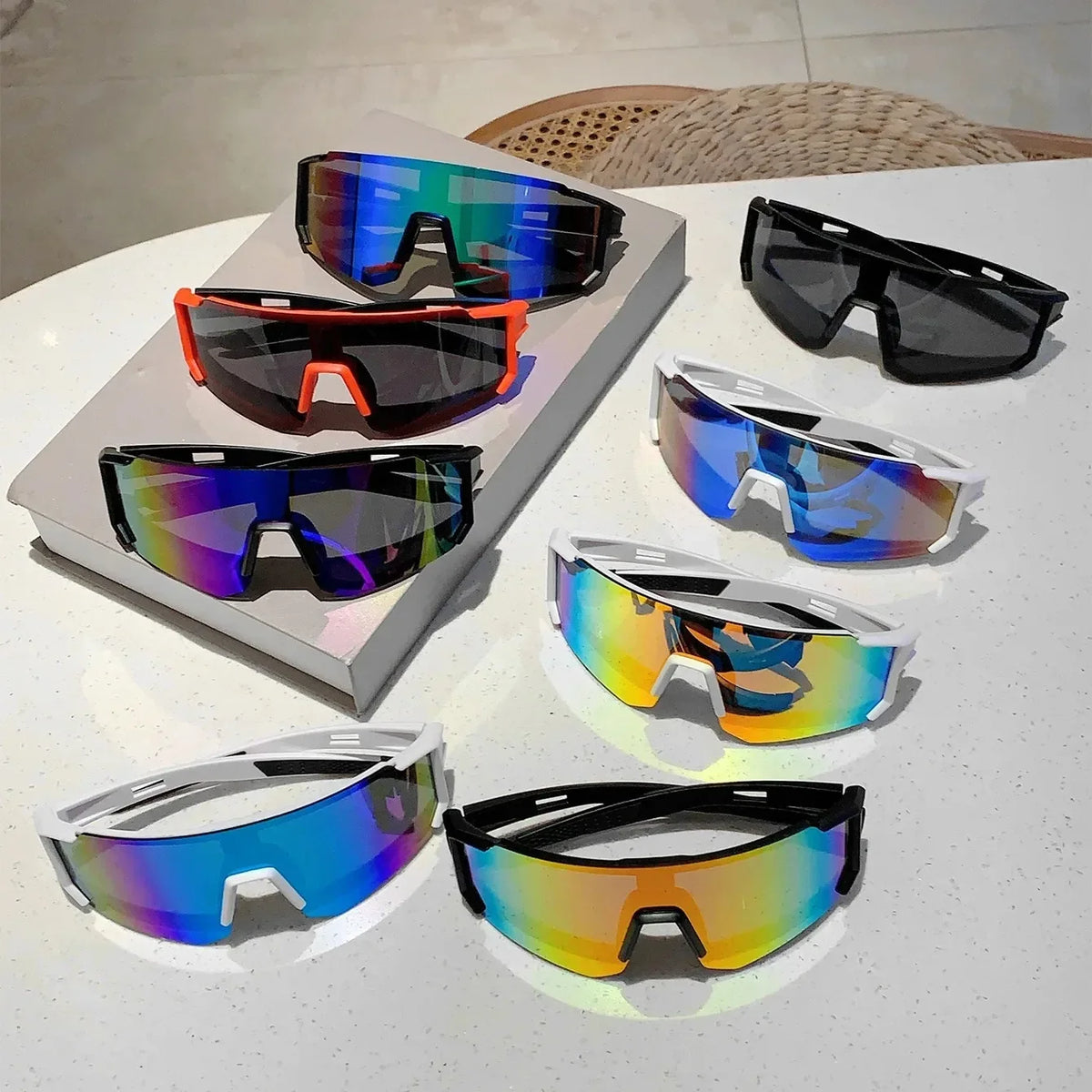 A collection of lightweight oversized sunglasses in various colors and styles displayed on a white surface.