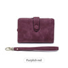 A plum purple card wallet with a leather strap shown next to the product.