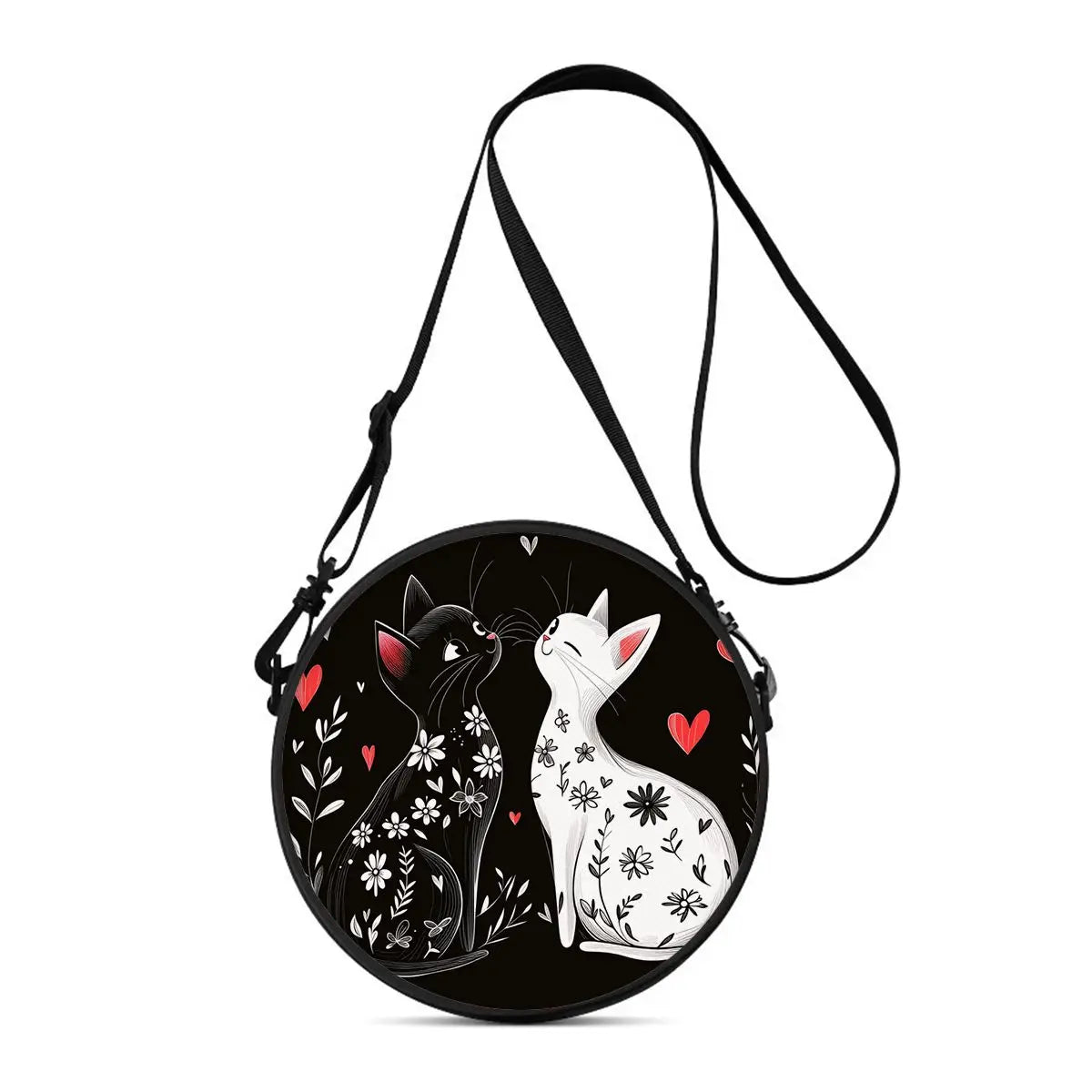 A black cartoon cat round crossbody bag with a black strap and white floral design.