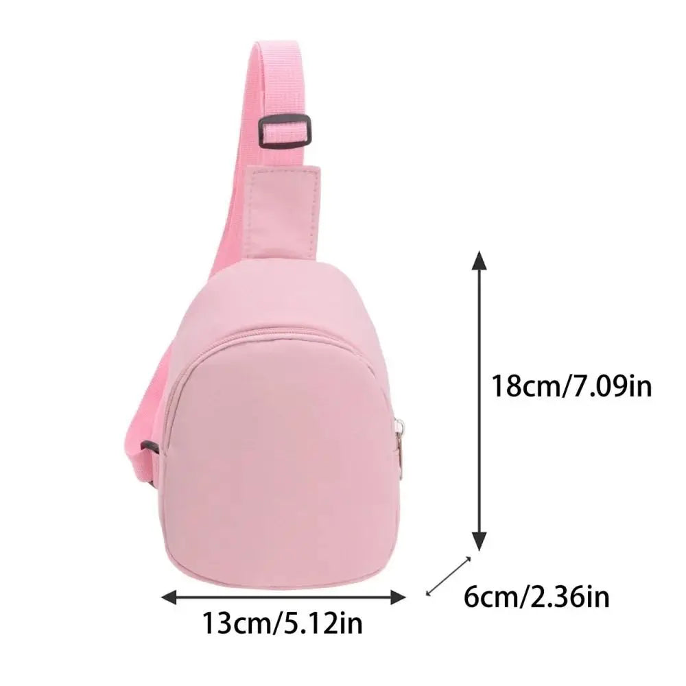 Pink nylon crossbody bag for kids shown with dimensions 18cm high and 13cm wide
