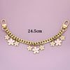 Gold chain necklace with bag flower pearl charm extensions, measuring 24.5 cm.