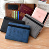 A collection of brown, pink, and blue passport and card wallets made of premium PU leather.