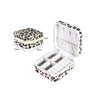 Leopard print PU leather jewelry storage box with a hinged lid and interior compartments