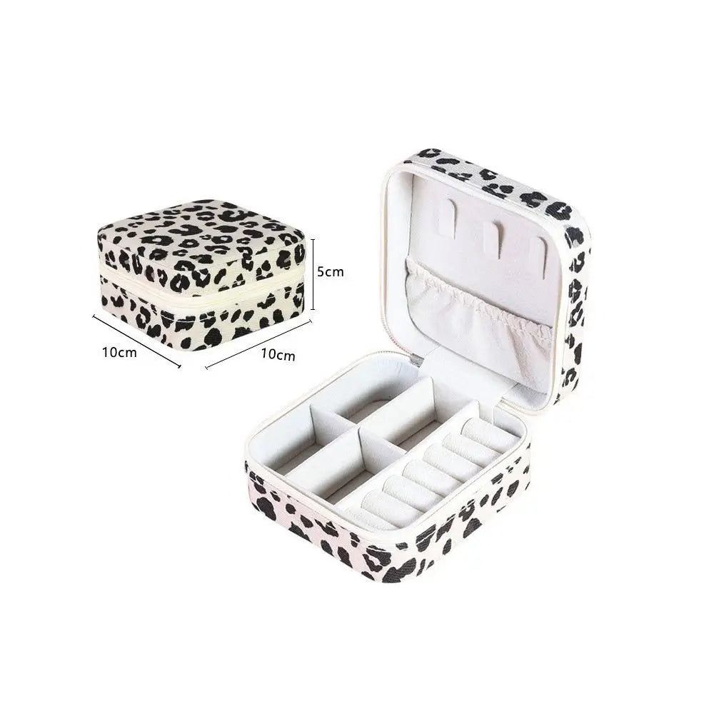 Leopard print PU leather jewelry storage box with a hinged lid and interior compartments