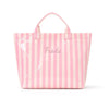 A pink and white striped waterproof PVC shoulder tote bag with the brand name Frada printed on the front.