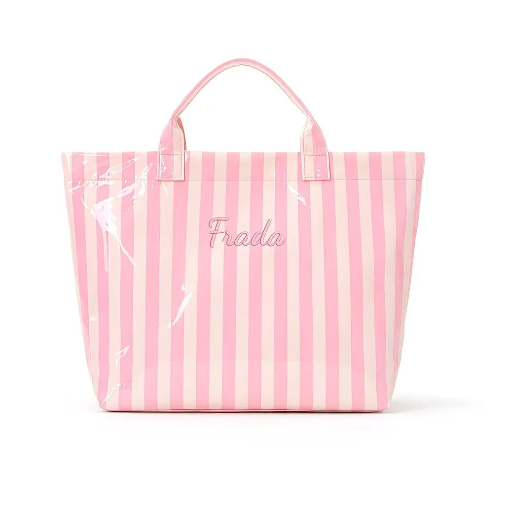 A pink and white striped waterproof PVC shoulder tote bag with the brand name Frada printed on the front.