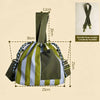 A olive green and light gray striped insulated lunch bag with a strap shown from above.