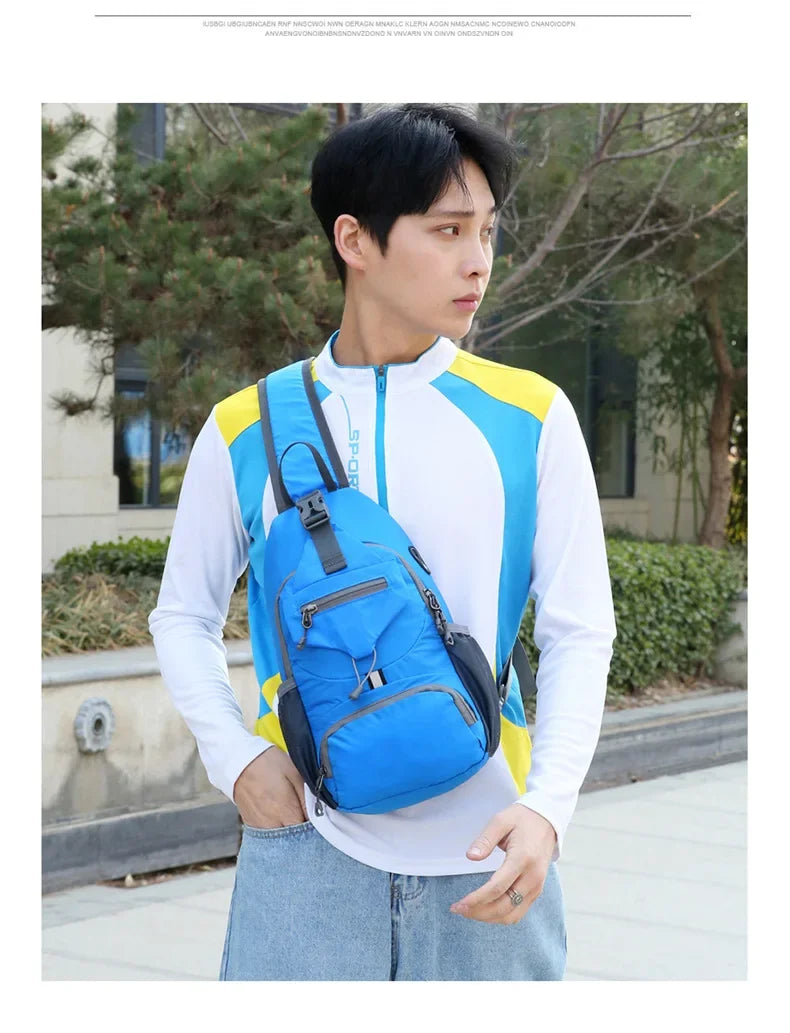 A man wearing a white shirt and jeans is holding a blue and yellow multi-functional nylon chest sling bag.