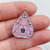 A pink teardrop-shaped celestial charm featuring a crescent moon, star, and an eye design.