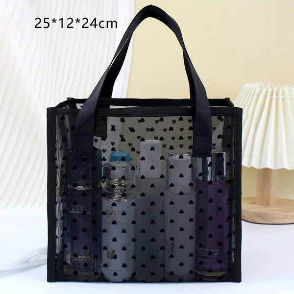 Black mesh storage bag filled with various glass makeup bottles and containers