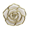 A gold-toned metal flower shaped bag hook with layered petals and a white center.