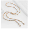 Gold-toned chain strap buckle for bags displayed on a white background.
