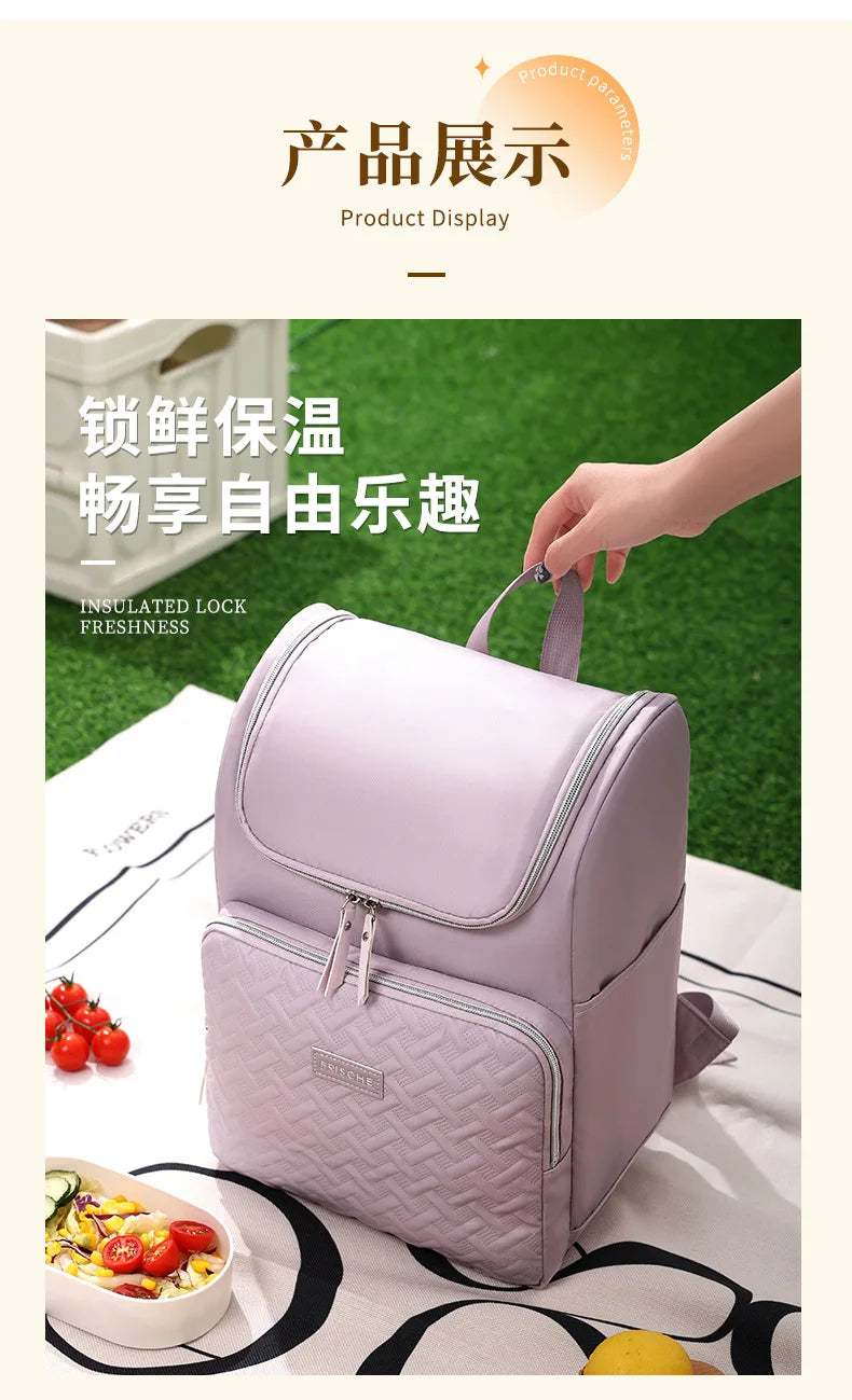 A light purple insulated backpack is shown with a side pocket, placed on a white cloth next to fresh food.
