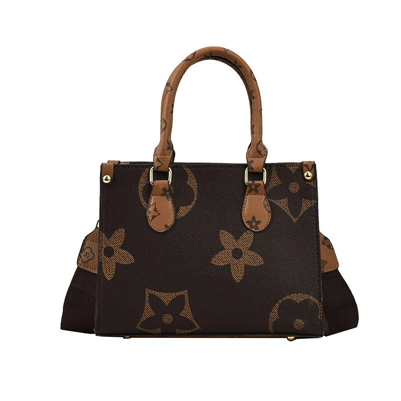 A brown patterned ladies' shoulder tote bag with a leather handle.