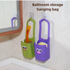 Bathroom storage hanging bag in green and purple colors mounted on a wall