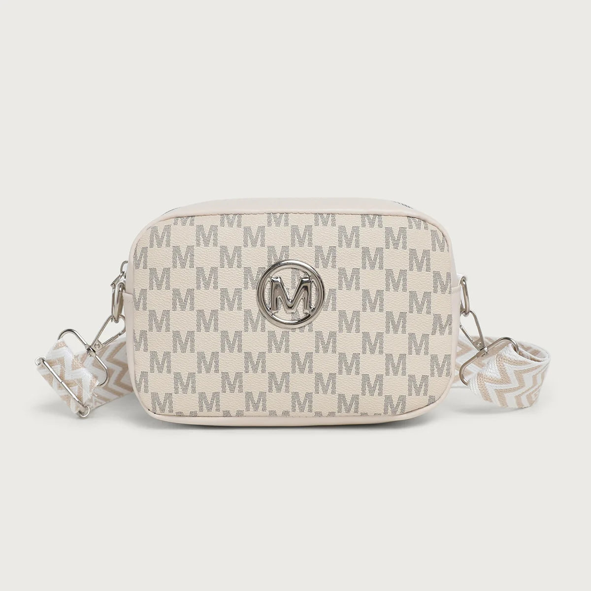 A beige crossbody bag featuring a repeating gray M pattern and a silver initial emblem.