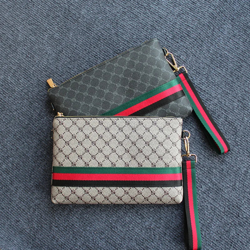 Fashion-Clutch in dark green and gray pattern with red and black striped trim.