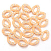 A collection of small, round, gold-toned acrylic link chains with clear stones for DIY jewelry making.