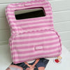 A pink striped Y2K makeup bag with a clear window and zipper is shown on a white surface.
