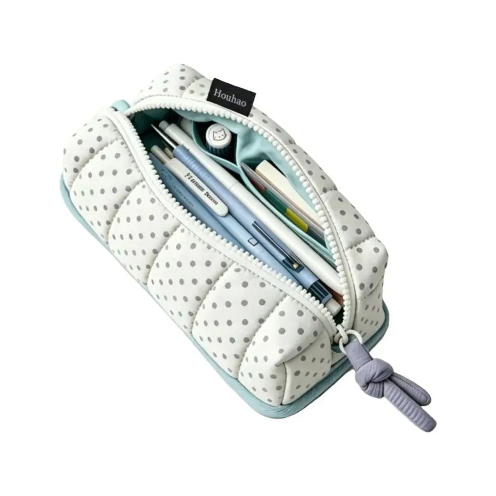 A light blue pencil case with a white dot pattern, featuring a zipper and a drawstring closure.