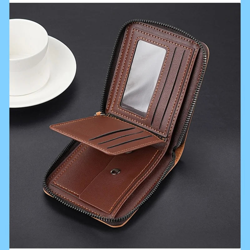 A brown leather compact wallet with a zipper closure and coin pocket is shown open on a dark surface.