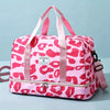 A pink leopard print nylon travel duffle bag with pink straps and zipper.