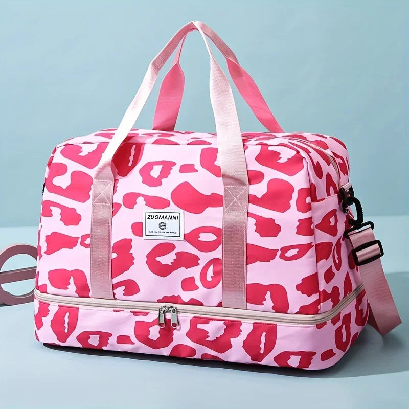A pink leopard print nylon travel duffle bag with pink straps and zipper.