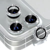 A close-up view of a glitter diamond camera lens protector with a metal frame for an iPhone, showing multiple lenses.