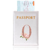 A pink leather passport holder featuring a rose design and a passport inside.