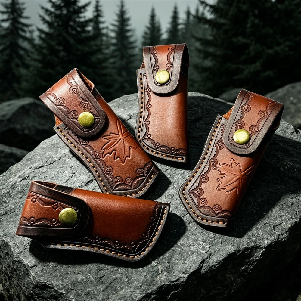 Three brown leather knife sheaths with decorative stitching and brass buttons resting on a dark rock.