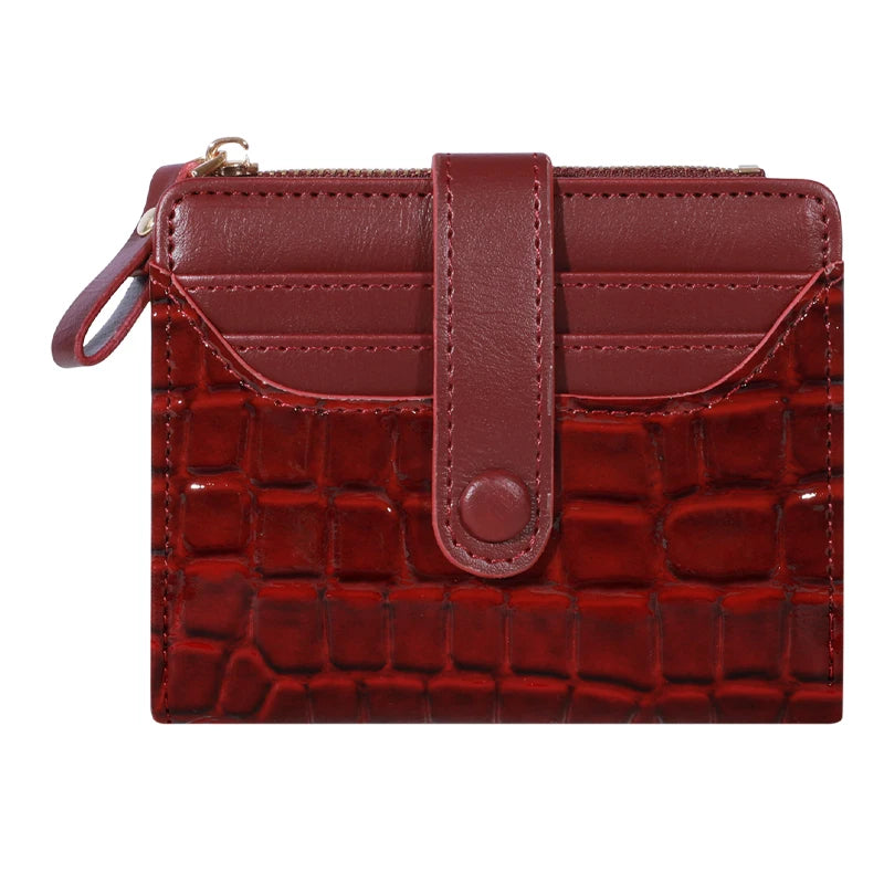 A maroon PU leather card wallet with a crocodile texture and a brown leather flap and double zip closure.