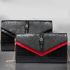 Black alligator pattern leather clutch bag with red lining and gold chain