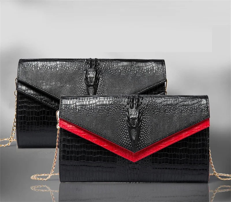 Black alligator pattern leather clutch bag with red lining and gold chain