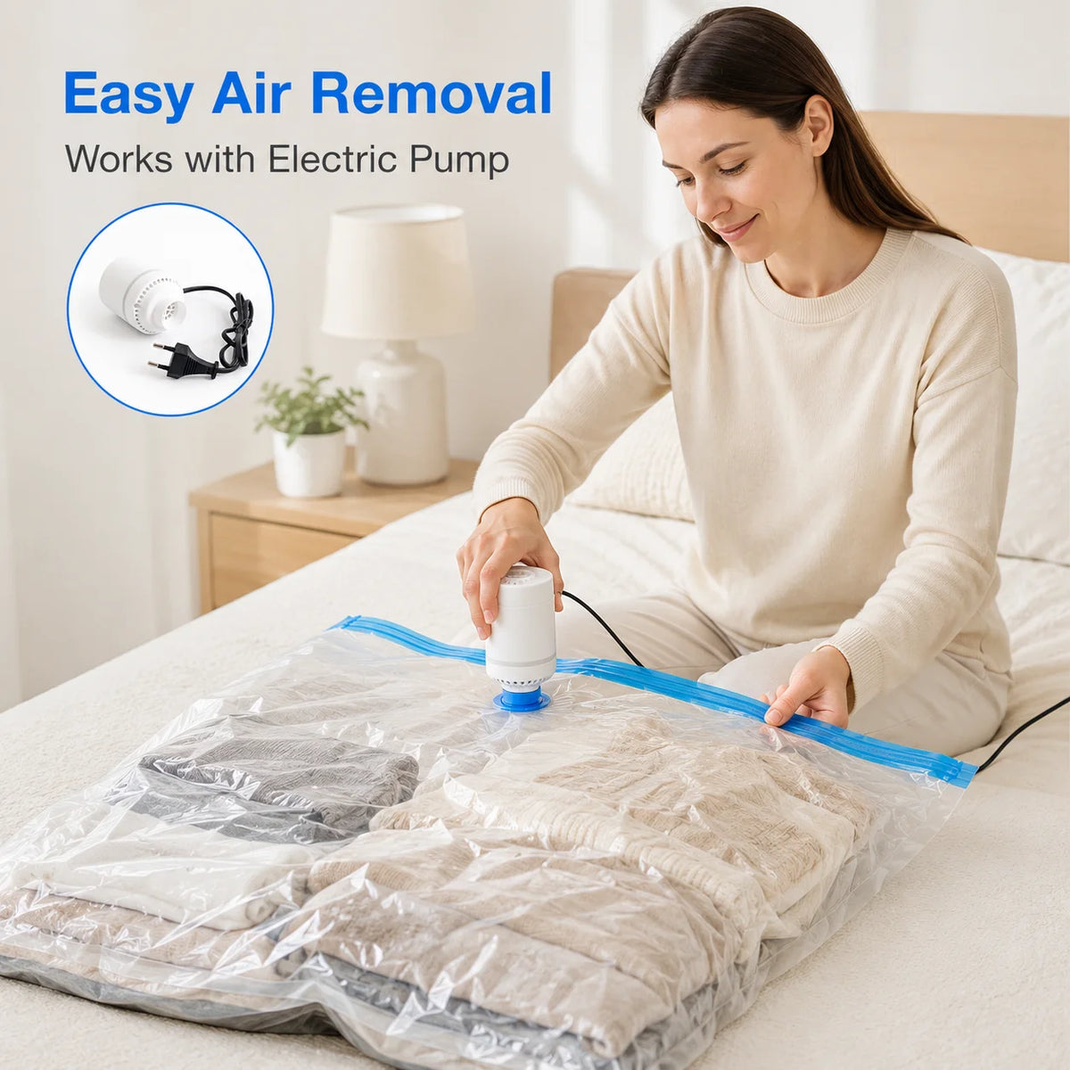 A woman is using a vacuum storage bag for clothes with an electric pump to compress garments.