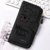 Black zippered pouch featuring a Winnie the Pooh bear design resting on a white surface.