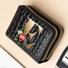 A black PU leather double-zip clutch wallet with a gold geometric print and floral embroidery.