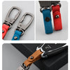 A display of genuine leather keyring keychains in various colors and styles.