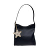A black leather bag charm featuring a hand-sewn rhinestone beaded star.