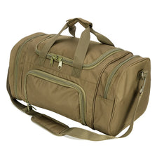 A olive green travel duffel bag with padded straps and zippered compartments.